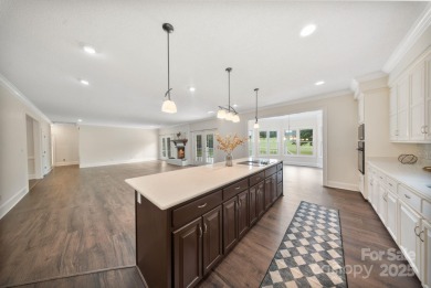 Welcome home to this stunningly remodeled 3BR/2BA residence on Rock Barn Golf and Spa in North Carolina - for sale on GolfHomes.com, golf home, golf lot