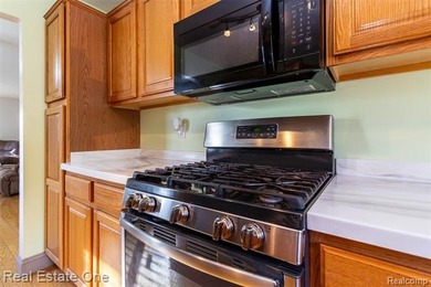 Enjoy the convenience of single level living in this beautiful on St. Clair Shores Country Club in Michigan - for sale on GolfHomes.com, golf home, golf lot