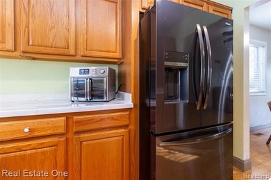 Enjoy the convenience of single level living in this beautiful on St. Clair Shores Country Club in Michigan - for sale on GolfHomes.com, golf home, golf lot