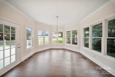 Welcome home to this stunningly remodeled 3BR/2BA residence on Rock Barn Golf and Spa in North Carolina - for sale on GolfHomes.com, golf home, golf lot