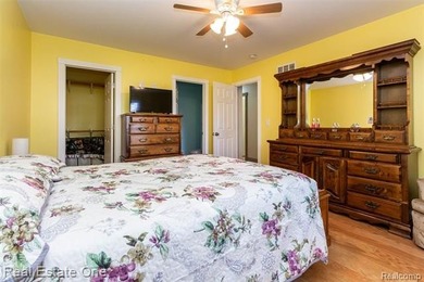 Enjoy the convenience of single level living in this beautiful on St. Clair Shores Country Club in Michigan - for sale on GolfHomes.com, golf home, golf lot