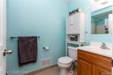 Enjoy the convenience of single level living in this beautiful on St. Clair Shores Country Club in Michigan - for sale on GolfHomes.com, golf home, golf lot