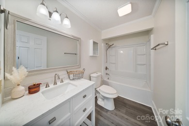 Welcome home to this stunningly remodeled 3BR/2BA residence on Rock Barn Golf and Spa in North Carolina - for sale on GolfHomes.com, golf home, golf lot
