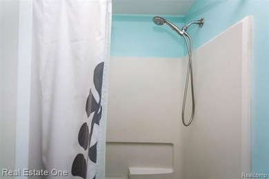 Enjoy the convenience of single level living in this beautiful on St. Clair Shores Country Club in Michigan - for sale on GolfHomes.com, golf home, golf lot