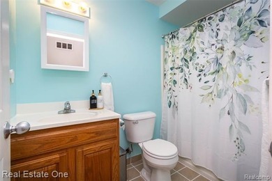 Enjoy the convenience of single level living in this beautiful on St. Clair Shores Country Club in Michigan - for sale on GolfHomes.com, golf home, golf lot