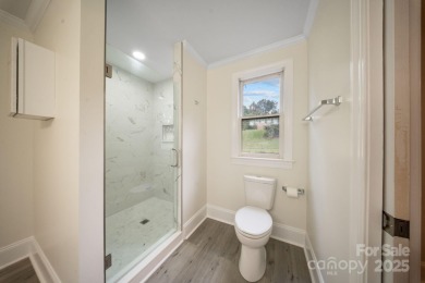 Welcome home to this stunningly remodeled 3BR/2BA residence on Rock Barn Golf and Spa in North Carolina - for sale on GolfHomes.com, golf home, golf lot