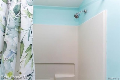 Enjoy the convenience of single level living in this beautiful on St. Clair Shores Country Club in Michigan - for sale on GolfHomes.com, golf home, golf lot