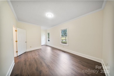 Welcome home to this stunningly remodeled 3BR/2BA residence on Rock Barn Golf and Spa in North Carolina - for sale on GolfHomes.com, golf home, golf lot