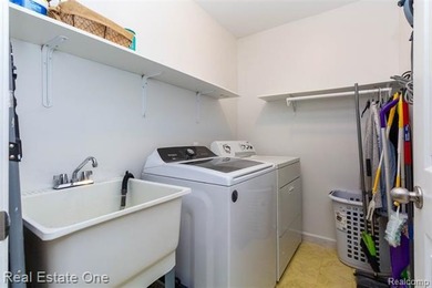 Enjoy the convenience of single level living in this beautiful on St. Clair Shores Country Club in Michigan - for sale on GolfHomes.com, golf home, golf lot