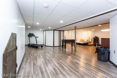 Enjoy the convenience of single level living in this beautiful on St. Clair Shores Country Club in Michigan - for sale on GolfHomes.com, golf home, golf lot