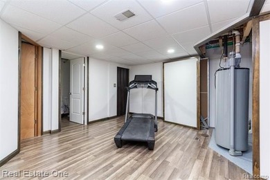 Enjoy the convenience of single level living in this beautiful on St. Clair Shores Country Club in Michigan - for sale on GolfHomes.com, golf home, golf lot
