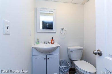 Enjoy the convenience of single level living in this beautiful on St. Clair Shores Country Club in Michigan - for sale on GolfHomes.com, golf home, golf lot