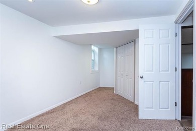 Enjoy the convenience of single level living in this beautiful on St. Clair Shores Country Club in Michigan - for sale on GolfHomes.com, golf home, golf lot