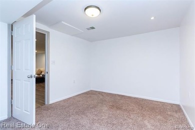 Enjoy the convenience of single level living in this beautiful on St. Clair Shores Country Club in Michigan - for sale on GolfHomes.com, golf home, golf lot