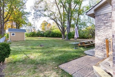 Enjoy the convenience of single level living in this beautiful on St. Clair Shores Country Club in Michigan - for sale on GolfHomes.com, golf home, golf lot