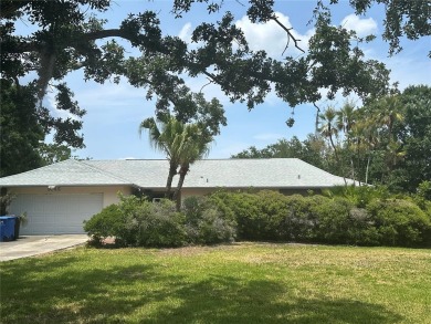 Welcome to this spacious 4-bedroom, 3-bath traditional home on Mangrove Bay Golf Course in Florida - for sale on GolfHomes.com, golf home, golf lot