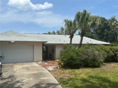 Welcome to this spacious 4-bedroom, 3-bath traditional home on Mangrove Bay Golf Course in Florida - for sale on GolfHomes.com, golf home, golf lot