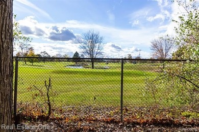 Enjoy the convenience of single level living in this beautiful on St. Clair Shores Country Club in Michigan - for sale on GolfHomes.com, golf home, golf lot