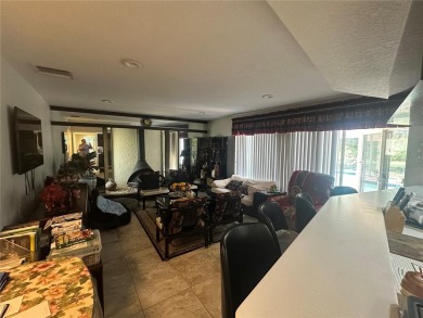 Welcome to this spacious 4-bedroom, 3-bath traditional home on Mangrove Bay Golf Course in Florida - for sale on GolfHomes.com, golf home, golf lot