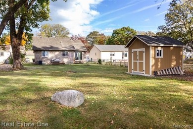 Enjoy the convenience of single level living in this beautiful on St. Clair Shores Country Club in Michigan - for sale on GolfHomes.com, golf home, golf lot