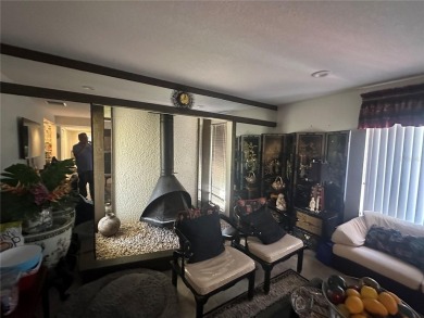 Welcome to this spacious 4-bedroom, 3-bath traditional home on Mangrove Bay Golf Course in Florida - for sale on GolfHomes.com, golf home, golf lot