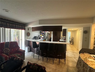 Welcome to this spacious 4-bedroom, 3-bath traditional home on Mangrove Bay Golf Course in Florida - for sale on GolfHomes.com, golf home, golf lot