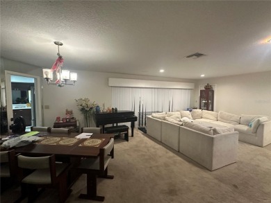 Welcome to this spacious 4-bedroom, 3-bath traditional home on Mangrove Bay Golf Course in Florida - for sale on GolfHomes.com, golf home, golf lot