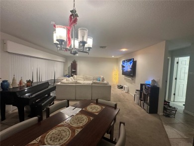 Welcome to this spacious 4-bedroom, 3-bath traditional home on Mangrove Bay Golf Course in Florida - for sale on GolfHomes.com, golf home, golf lot