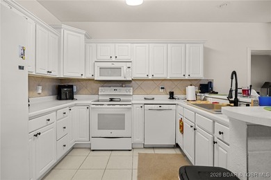 Enjoy peaceful lake living in this beautifully situated on The Club At Old Kinderhook in Missouri - for sale on GolfHomes.com, golf home, golf lot