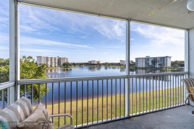 EXPERIENCE DRAMATIC WATER VIEWS FROM THIS CORNER TURNKEY UNIT! on Palm-Aire Country Club and Resort - Palms in Florida - for sale on GolfHomes.com, golf home, golf lot