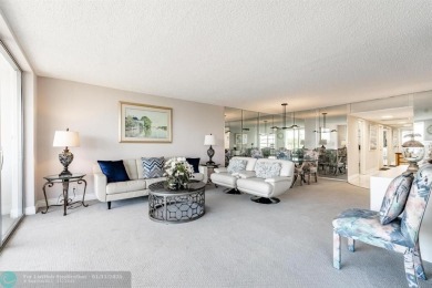 EXPERIENCE DRAMATIC WATER VIEWS FROM THIS CORNER TURNKEY UNIT! on Palm-Aire Country Club and Resort - Palms in Florida - for sale on GolfHomes.com, golf home, golf lot
