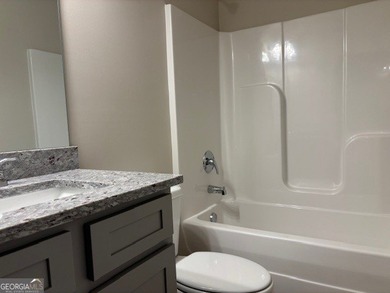 An early CHRISTMAS GIFT from PREMIER HOMES ! This huge price on Griffin Country Club in Georgia - for sale on GolfHomes.com, golf home, golf lot