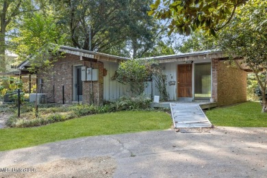 Built by Carroll Ishee in 1960 this home retains it's cork on Gulf Hills Golf Club in Mississippi - for sale on GolfHomes.com, golf home, golf lot