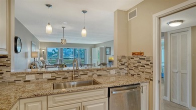 Rarely available 3-bedroom end unit featuring sweeping golf on Palm Aire Country Club of Sarasota in Florida - for sale on GolfHomes.com, golf home, golf lot
