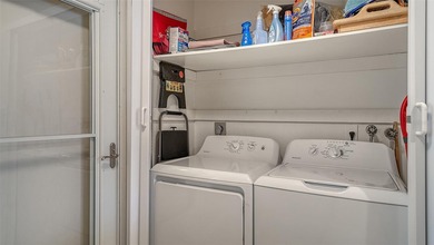 Rarely available 3-bedroom end unit featuring sweeping golf on Palm Aire Country Club of Sarasota in Florida - for sale on GolfHomes.com, golf home, golf lot