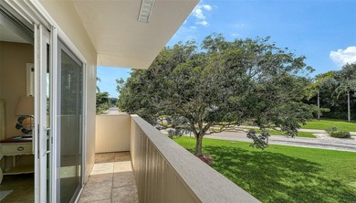 Rarely available 3-bedroom end unit featuring sweeping golf on Palm Aire Country Club of Sarasota in Florida - for sale on GolfHomes.com, golf home, golf lot