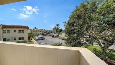 Rarely available 3-bedroom end unit featuring sweeping golf on Palm Aire Country Club of Sarasota in Florida - for sale on GolfHomes.com, golf home, golf lot