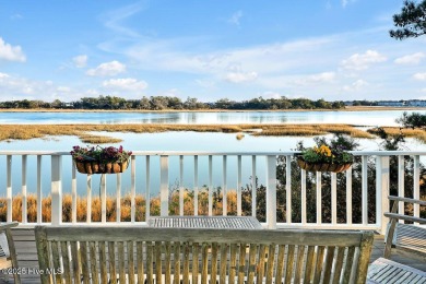 Awake to the tranquil beauty of sunrises over the waterway on Country Club of Landfall in North Carolina - for sale on GolfHomes.com, golf home, golf lot