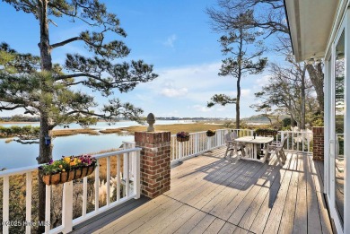 Awake to the tranquil beauty of sunrises over the waterway on Country Club of Landfall in North Carolina - for sale on GolfHomes.com, golf home, golf lot