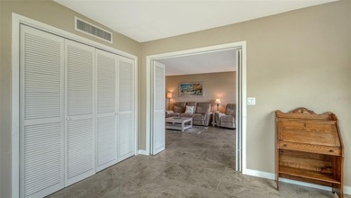 Rarely available 3-bedroom end unit featuring sweeping golf on Palm Aire Country Club of Sarasota in Florida - for sale on GolfHomes.com, golf home, golf lot