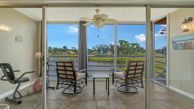 Rarely available 3-bedroom end unit featuring sweeping golf on Palm Aire Country Club of Sarasota in Florida - for sale on GolfHomes.com, golf home, golf lot