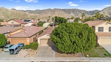 This Ahwatukee Foothills home boasts a pebble-tech pool, 3 on Club West Golf Club in Arizona - for sale on GolfHomes.com, golf home, golf lot