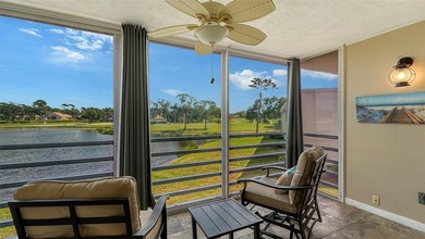Rarely available 3-bedroom end unit featuring sweeping golf on Palm Aire Country Club of Sarasota in Florida - for sale on GolfHomes.com, golf home, golf lot