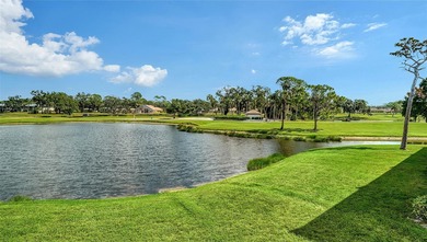 Rarely available 3-bedroom end unit featuring sweeping golf on Palm Aire Country Club of Sarasota in Florida - for sale on GolfHomes.com, golf home, golf lot
