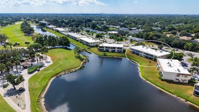 Rarely available 3-bedroom end unit featuring sweeping golf on Palm Aire Country Club of Sarasota in Florida - for sale on GolfHomes.com, golf home, golf lot