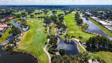 Rarely available 3-bedroom end unit featuring sweeping golf on Palm Aire Country Club of Sarasota in Florida - for sale on GolfHomes.com, golf home, golf lot