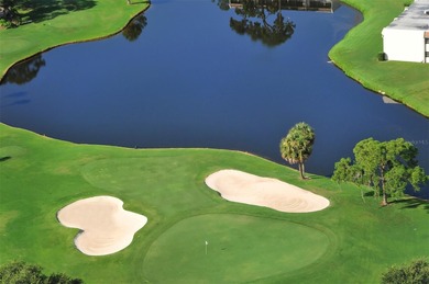Rarely available 3-bedroom end unit featuring sweeping golf on Palm Aire Country Club of Sarasota in Florida - for sale on GolfHomes.com, golf home, golf lot