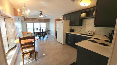 TWO BEDROOM, ONE BATHROOM MOBILE HOME IN AN ACTIVE 55+ COMMUNITY on River Run Golf Links in Florida - for sale on GolfHomes.com, golf home, golf lot