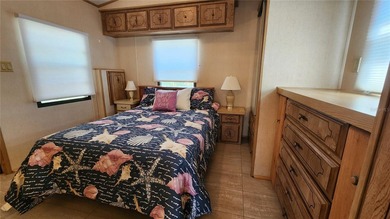 TWO BEDROOM, ONE BATHROOM MOBILE HOME IN AN ACTIVE 55+ COMMUNITY on River Run Golf Links in Florida - for sale on GolfHomes.com, golf home, golf lot