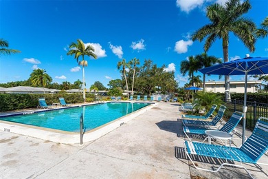 Rarely available 3-bedroom end unit featuring sweeping golf on Palm Aire Country Club of Sarasota in Florida - for sale on GolfHomes.com, golf home, golf lot